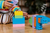 close-up-little-boy-playing-with-toys