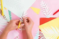 top-view-woman-cutting-paper-tree-branches